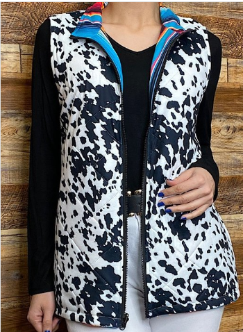 Serape/Cow printed reversible zipper vest w pockets.
